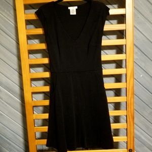 Esley Knee length black dress with pockets size small